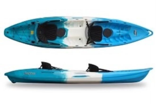 Vibrant kayaks stacked on a seaside rack at sunset in the Philippines, perfect for a serene adventure.